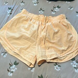 Women’s orange Nike shorts